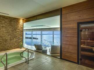 Experience ultimate relaxation in this luxurious spa featuring a soothing jacuzzi and a private sauna, perfect for unwinding.