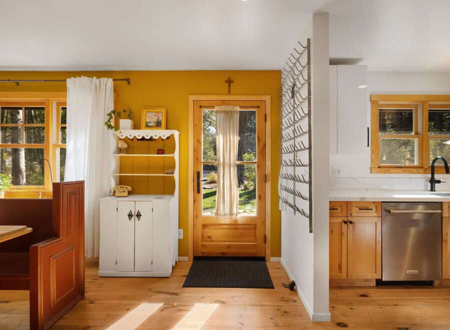 This charming home features a bright and airy kitchen and dining area, perfect for entertaining.