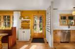 This charming home features a bright and airy kitchen and dining area, perfect for entertaining.