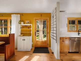 This charming home features a bright and airy kitchen and dining area, perfect for entertaining.