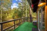 Enjoy breathtaking forest views from this charming balcony, perfect for morning coffee or evening relaxation.