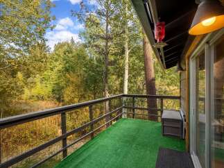 Enjoy breathtaking forest views from this charming balcony, perfect for morning coffee or evening relaxation.