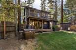 Escape to this charming cabin nestled among tall pine trees, offering a private backyard oasis.
