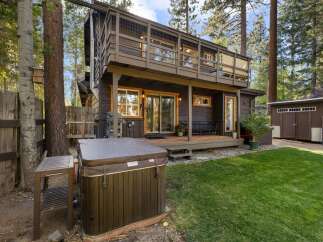 Escape to this charming cabin retreat, complete with a relaxing hot tub perfect for unwinding after a day of adventure.