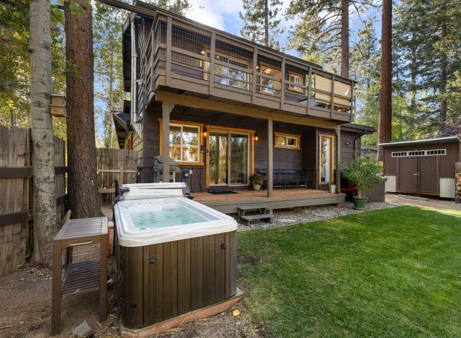 Escape to this charming cabin retreat, complete with a relaxing hot tub perfect for unwinding after a day of adventure.