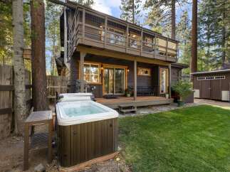 Escape to this charming cabin retreat, complete with a relaxing hot tub perfect for unwinding after a day of adventure.