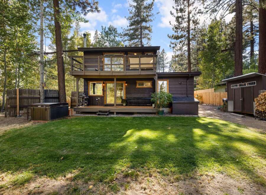 Escape to this charming mountain retreat featuring a multi-level home with a private balcony and a spacious deck perfect for outdoor entertaining.