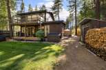 Enjoy outdoor living with this charming property featuring a spacious deck perfect for entertaining and a lush green lawn ideal for relaxation.