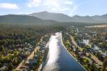 Experience waterfront living at its finest in this stunning aerial view of a picturesque community nestled along a serene river.