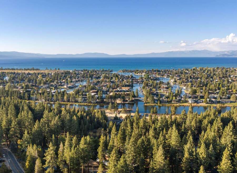 Experience the ultimate lakeside living with this stunning aerial view of a waterfront community.