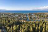 Experience the ultimate lakeside living with this stunning aerial view of a waterfront community.