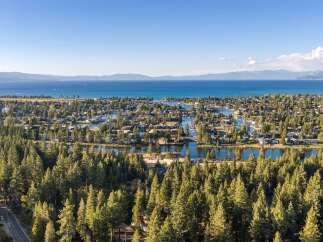 Experience the ultimate lakeside living with this stunning aerial view of a waterfront community.