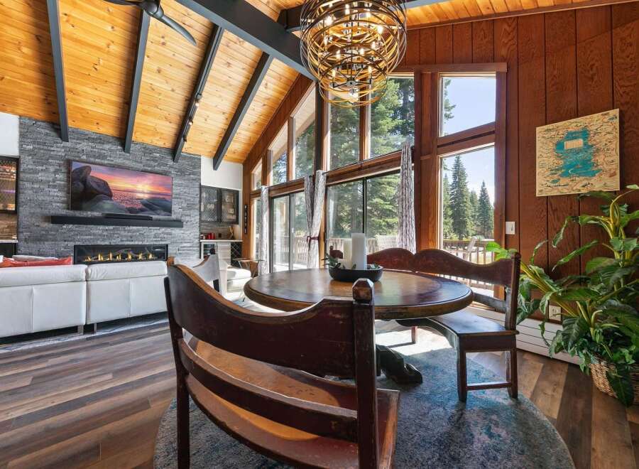 Experience rustic charm and modern comfort in this stunning living and dining area.