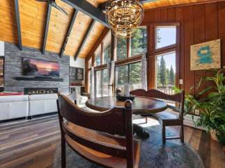 Experience rustic charm and modern comfort in this stunning living and dining area.