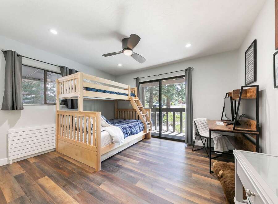 This charming bedroom features a sturdy wooden bunk bed, perfect for accommodating guests or family.