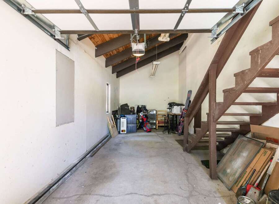 Discover ample storage and potential in this versatile garage space.