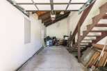 Discover ample storage and potential in this versatile garage space.