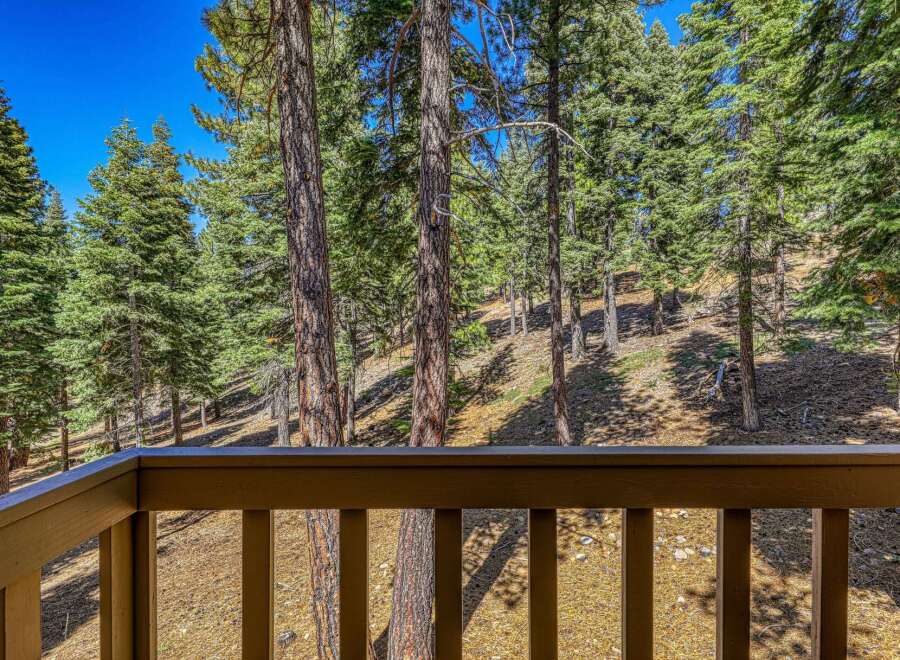 Enjoy breathtaking forest views from this property's private balcony, perfect for morning coffee or evening relaxation.