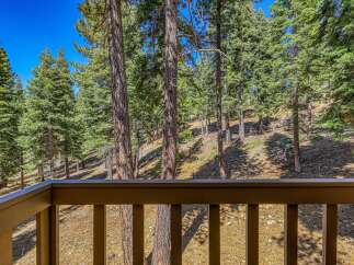 Enjoy breathtaking forest views from this property's private balcony, perfect for morning coffee or evening relaxation.