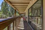 Enjoy the serene mountain setting from this charming covered porch, perfect for morning coffee or evening relaxation.