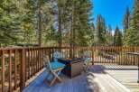Enjoy the crisp mountain air from this charming deck, complete with a cozy fire pit and comfortable seating.