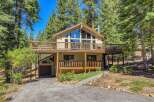Nestled amidst towering pine trees, this charming multi-level home offers a serene mountain retreat.