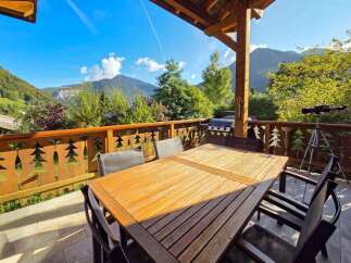 Enjoy breathtaking mountain views from this charming balcony, perfect for al fresco dining or morning coffee.