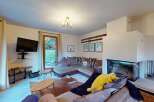 Experience cozy living in this inviting living room, featuring a plush sectional sofa perfect for relaxation.