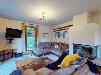 Experience cozy living in this inviting living room, featuring a plush sectional sofa perfect for relaxation.
