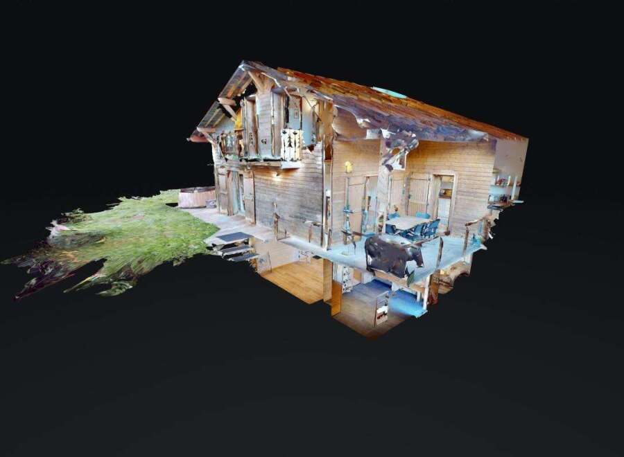 Experience rustic charm in this wooden cabin, featuring a spacious deck with outdoor dining and a relaxing hot tub.