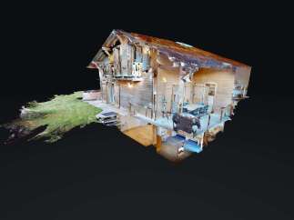 Experience rustic charm in this wooden cabin, featuring a spacious deck with outdoor dining and a relaxing hot tub.