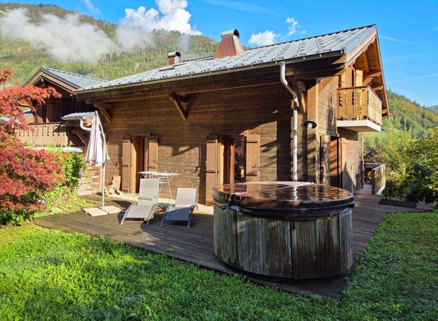 Experience ultimate relaxation in this charming wooden chalet, featuring a private hot tub perfect for unwinding after a day of mountain adventures.