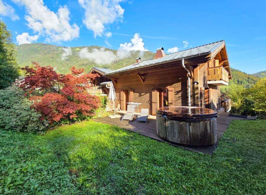 Experience ultimate relaxation in this charming wooden chalet, featuring a private hot tub perfect for unwinding after a day of mountain adventures.