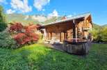Experience ultimate relaxation in this charming wooden chalet, featuring a private hot tub perfect for unwinding after a day of mountain adventures.