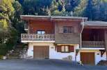 Discover this charming wooden chalet nestled in a serene mountain setting, perfect for a cozy getaway.