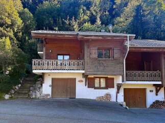 Discover this charming wooden chalet nestled in a serene mountain setting, perfect for a cozy getaway.