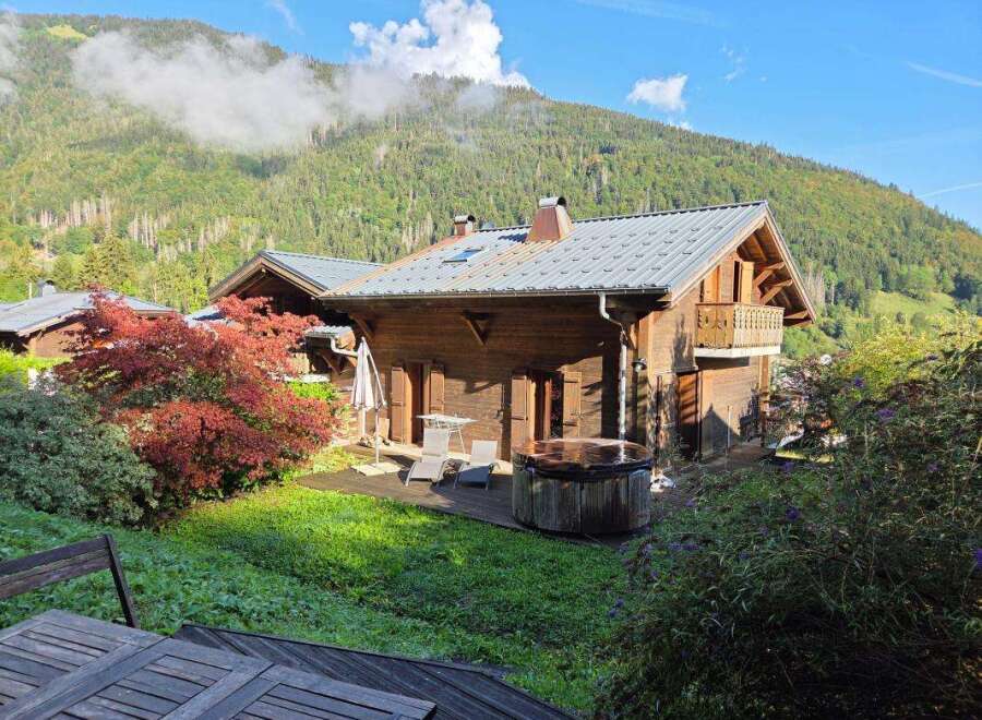 Experience the ultimate mountain retreat in this charming wooden chalet, featuring a private hot tub perfect for relaxing after a day of adventure.