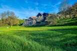 Discover this charming property nestled on a lush green hillside, offering breathtaking views and a serene atmosphere.