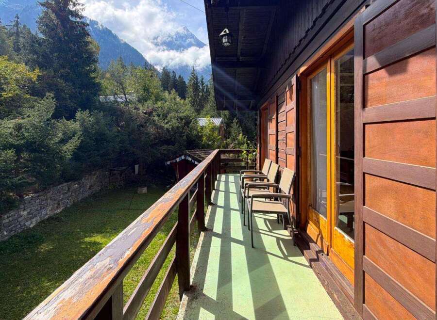 Enjoy breathtaking mountain views from this charming wooden balcony, perfect for morning coffee or evening relaxation.