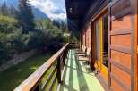 Enjoy breathtaking mountain views from this charming wooden balcony, perfect for morning coffee or evening relaxation.