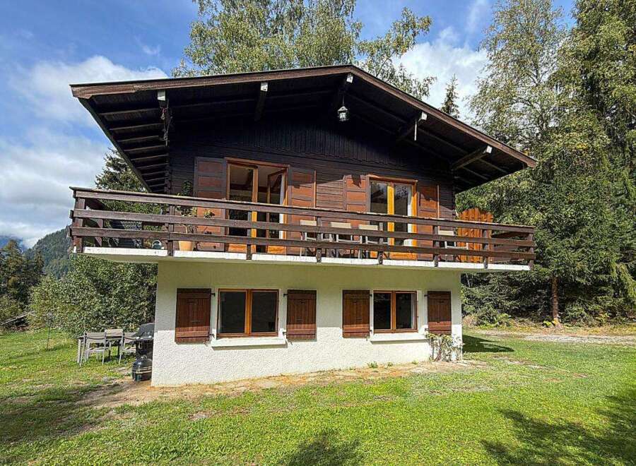 Experience the charm of this rustic wooden chalet, nestled amidst lush greenery and offering breathtaking mountain views.