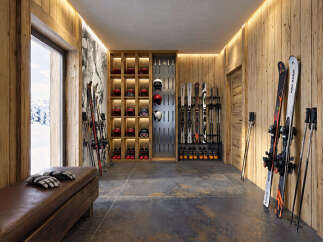Experience the ultimate ski lifestyle with this dedicated ski room, featuring ample storage for skis, helmets, and boots.