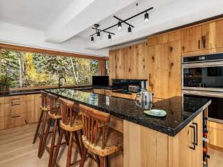 Experience the perfect blend of modern luxury and natural beauty in this stunning kitchen.