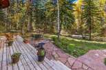 Enjoy the serene beauty of autumn from this charming outdoor living space.