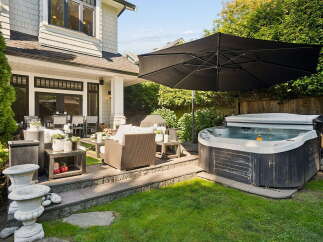 Experience ultimate relaxation in this backyard oasis, featuring a luxurious hot tub perfect for unwinding.