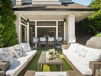Experience seamless indoor-outdoor living with this stunning covered patio, perfect for entertaining or relaxing.
