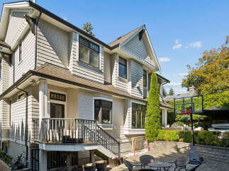 Discover this stunning home featuring a beautiful shingle exterior and a spacious backyard perfect for recreation.