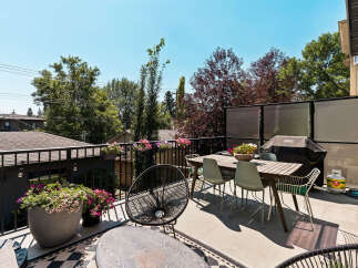 Enjoy outdoor living on this spacious deck, perfect for entertaining or relaxing.