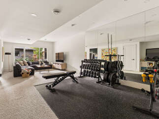 Transform your home into a personal fitness sanctuary with this dedicated gym space.