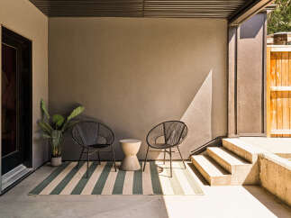 Enjoy your morning coffee or evening relaxation in this inviting outdoor seating area.
